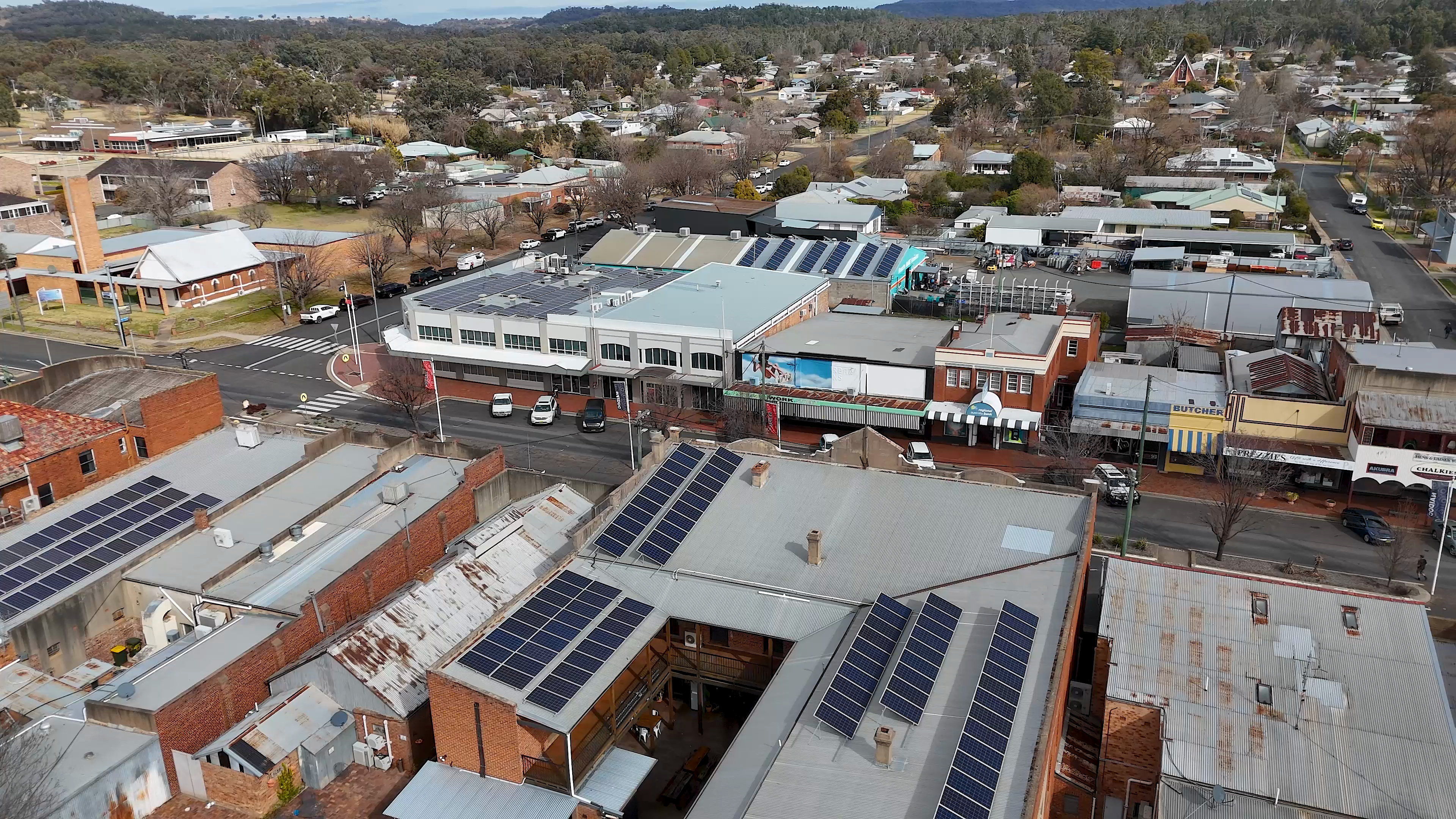 Aerial view of solar installations across commercial rooftops